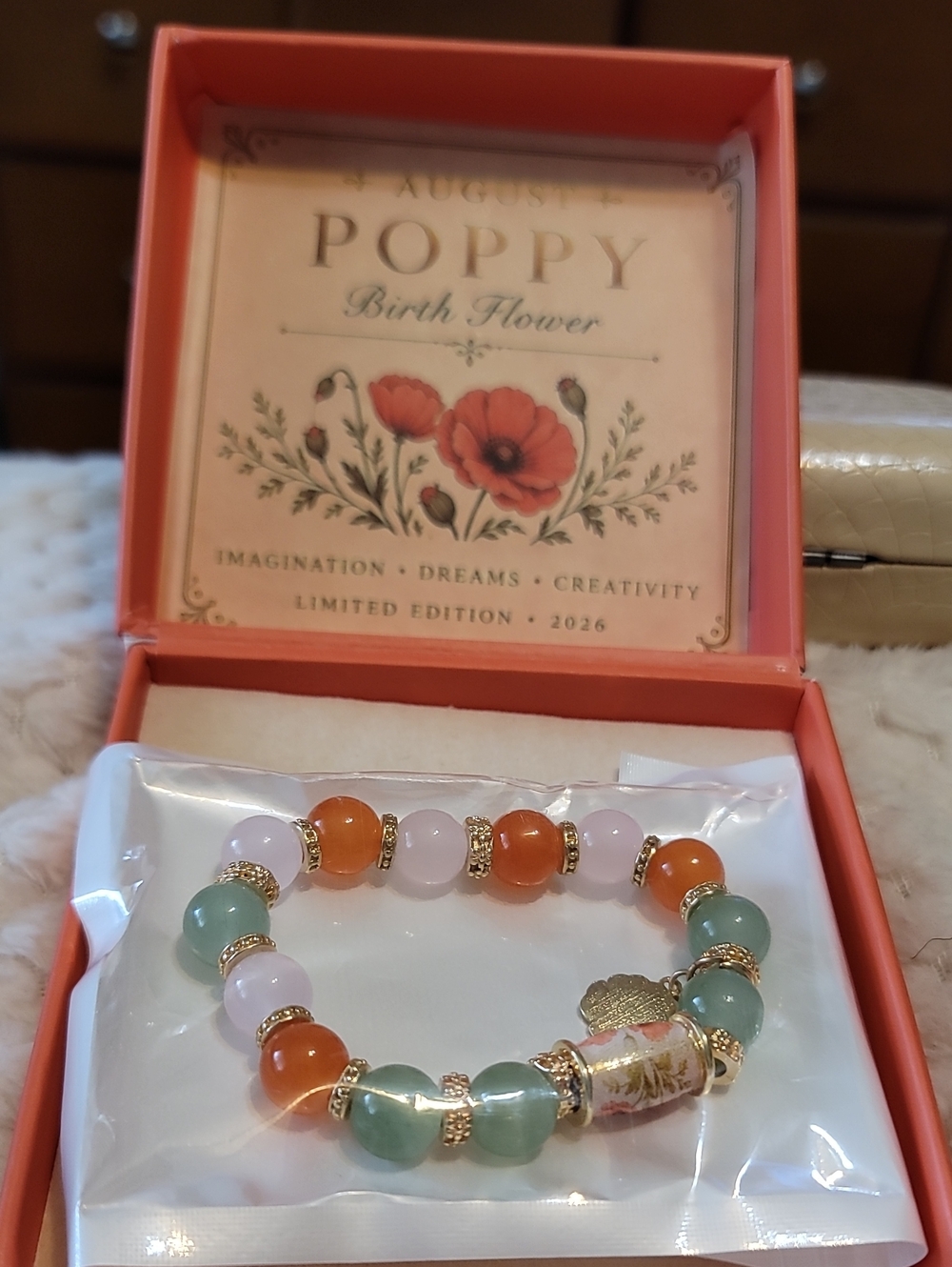 Poppy Light Green And Red Bead Stretch Bracelet with Gold Accents  With Box